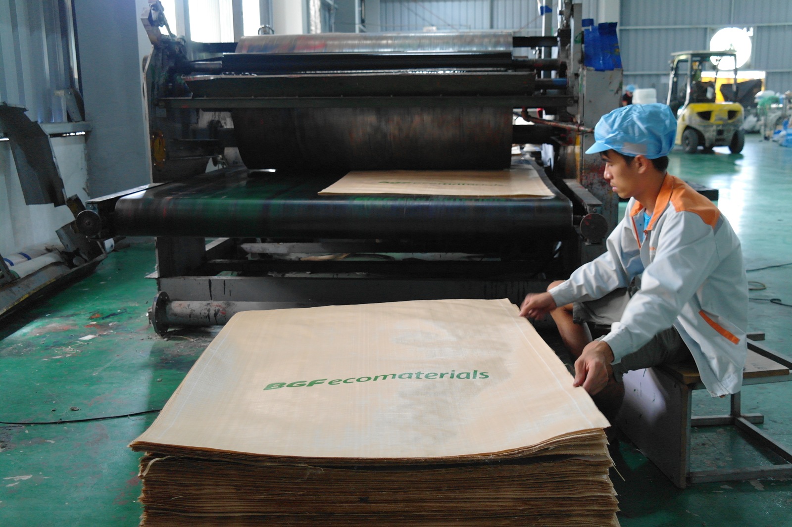 Operator printing markings onto bag fabric